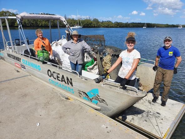 Photo of clean up day with the boat and crew